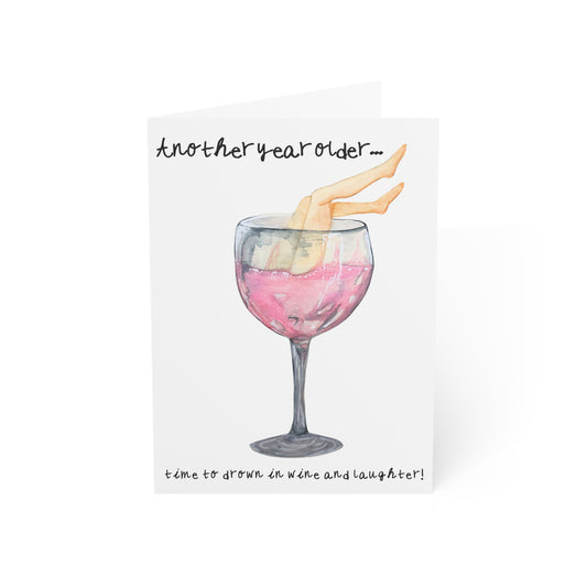 Birthday Greeting Card – “Another Year Older… Time to Drown in Wine and Laughter” (Wine Glass Illustration)